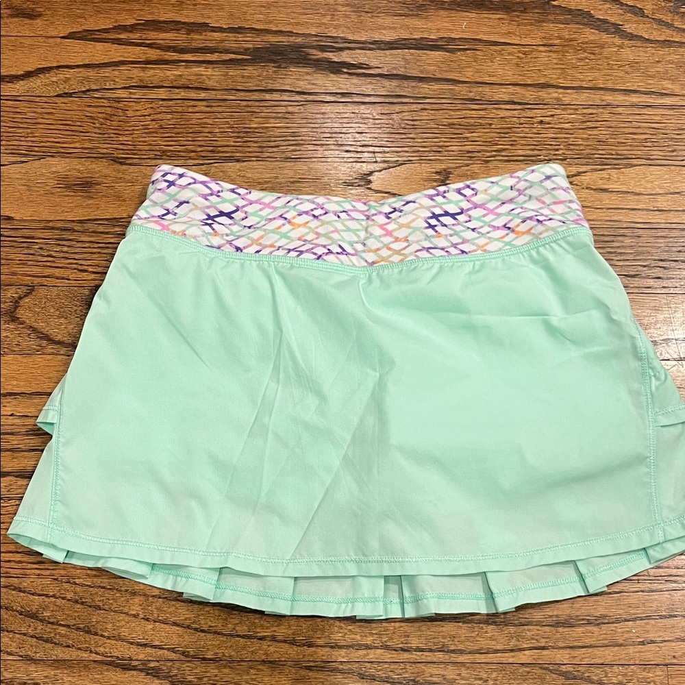 Lululemon Athletica ivivva Green ruffle skirt with purple and green waistband